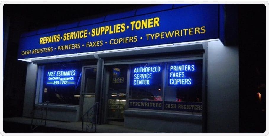 Storefront of a service shop for printers, faxes, copiers, and typewriters.