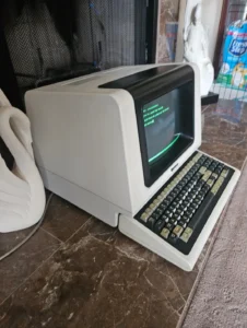 Vintage computer terminal with green text
